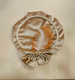 Pietenmuts créme strik bruin